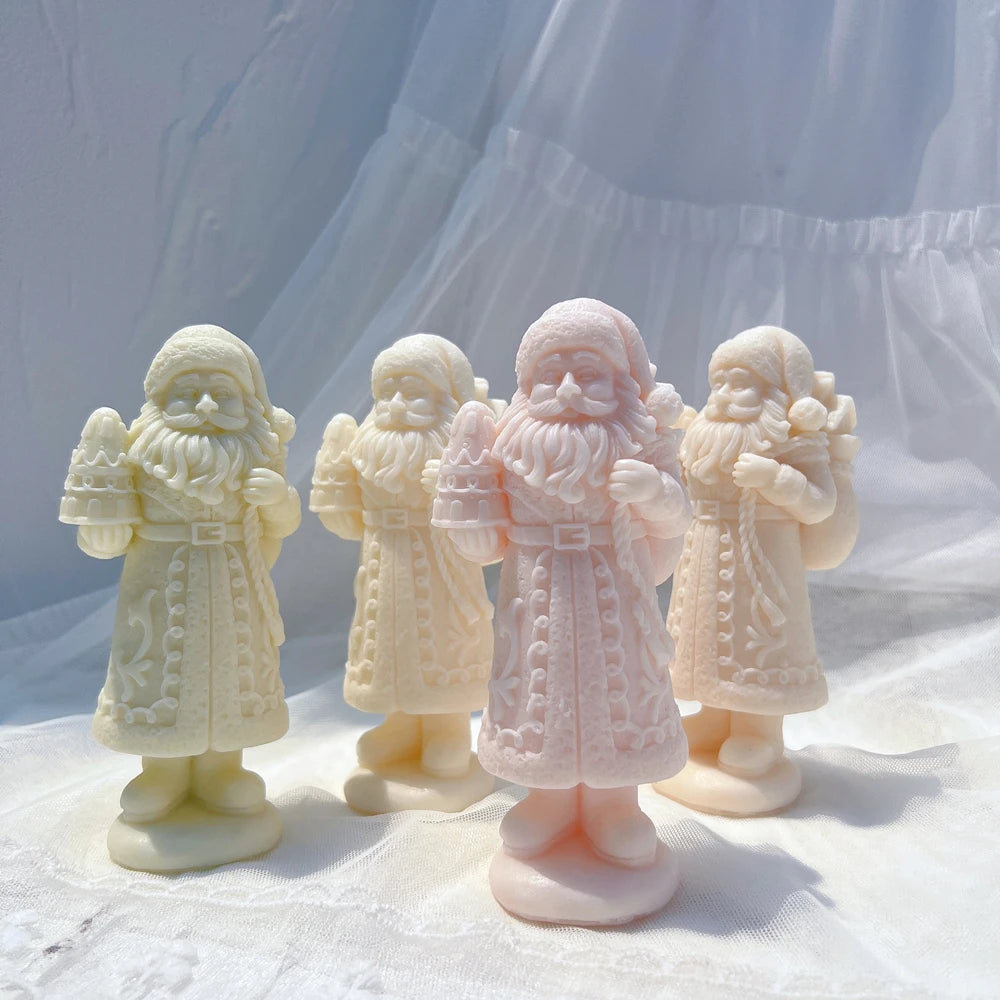 Pastel long-coat Santa candle castings with icing-style decoration