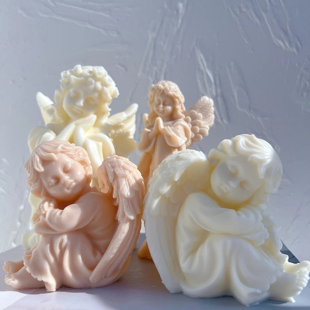 Angled seated cherub and standing angel castings showing wing detail