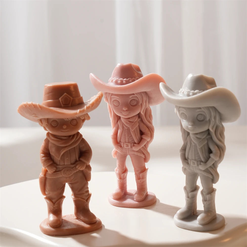 Three cowboy and cowgirl castings in different colors