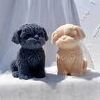 Dark and cream seated Shih Tzu-style puppy castings with shaggy muzzles