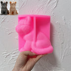 Pink silicone seated tiger cub mold held open