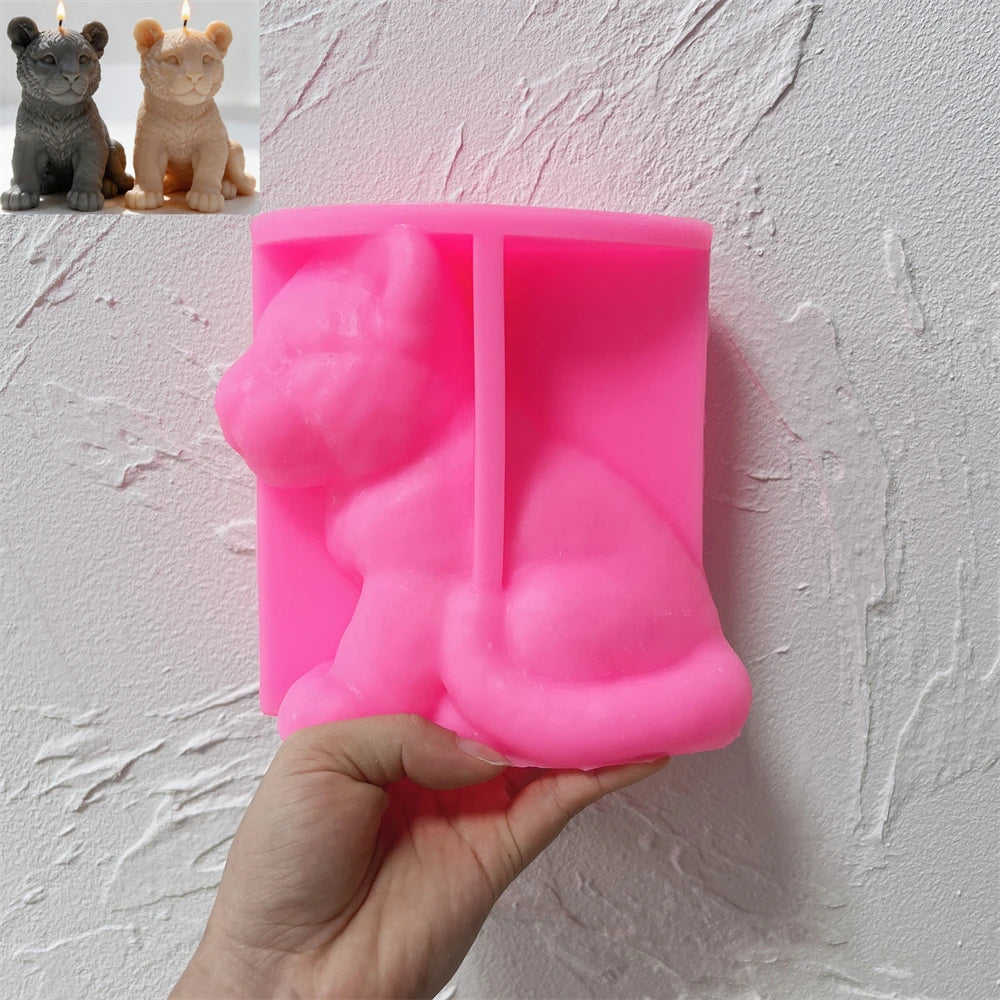 Pink silicone seated tiger cub mold held open