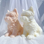 Angled view of two textured terrier figures with upright ears and front paws