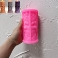 Pink ornate skull pillar silicone mold held in one hand