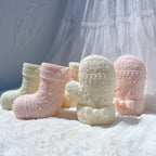 Pastel stocking and mitten castings with patterned cuffs and decorative trim