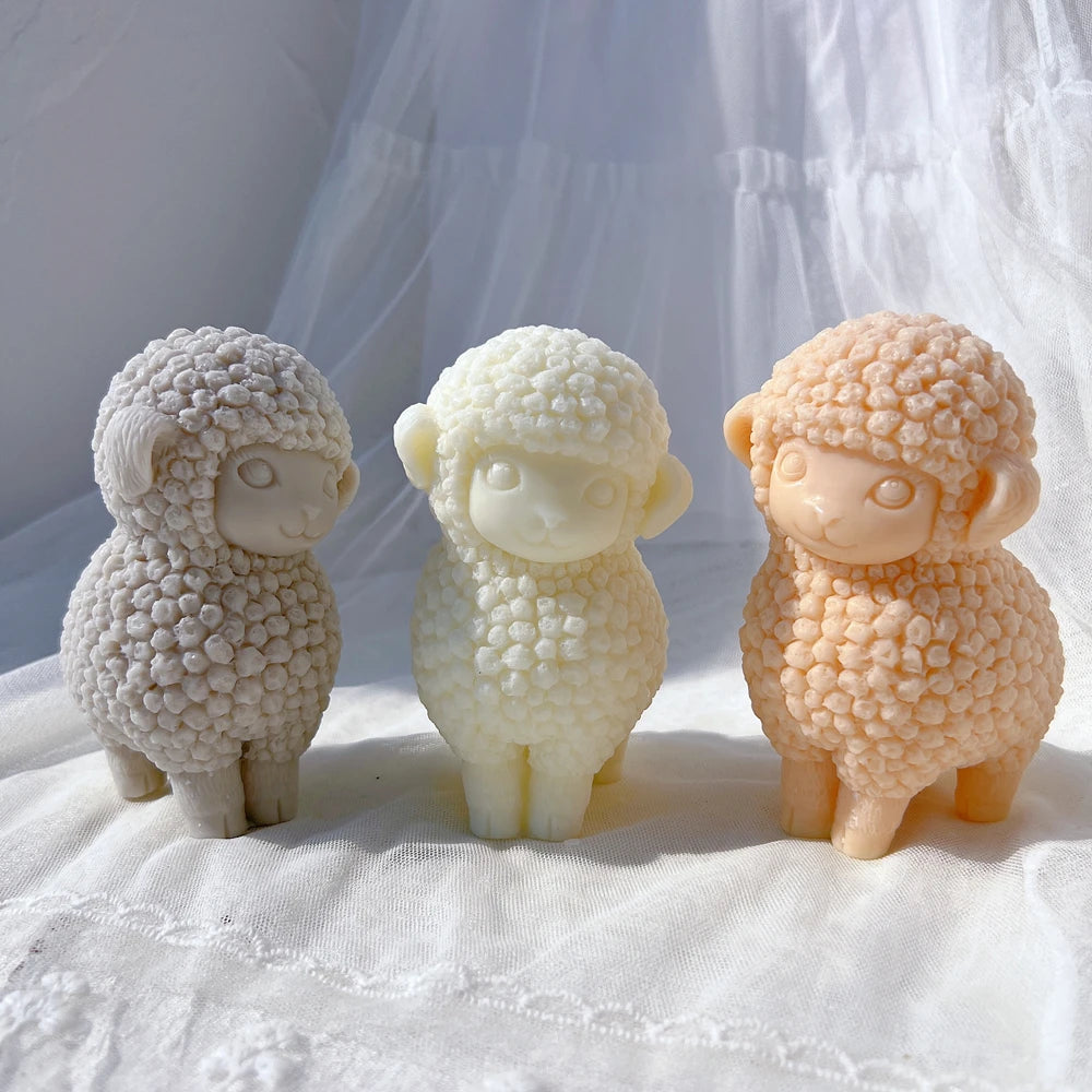 Front view of three lamb figures with rounded wool texture
