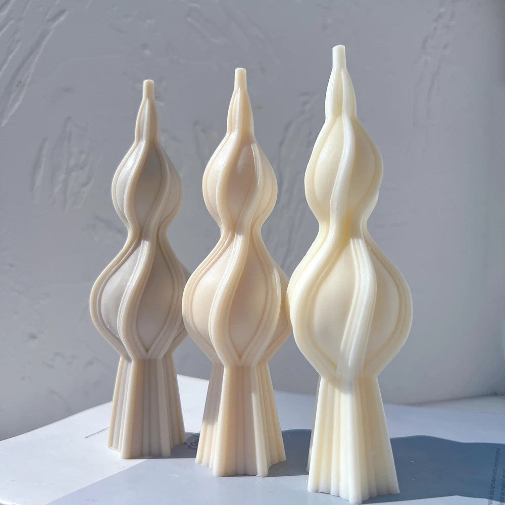 Cream and beige double-bulb spindle shapes viewed from the front