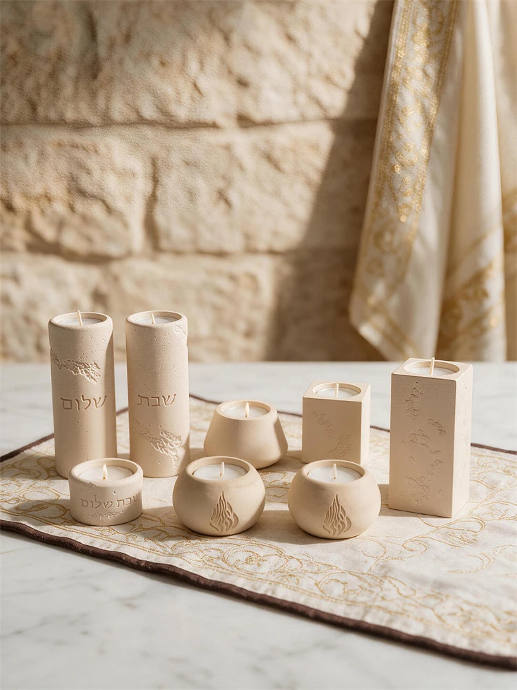 Selection of tall round and rectangular Hebrew-inspired decorative candle holders