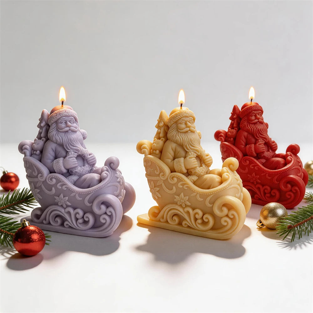 Purple yellow and red Santa sleigh candles beside festive greenery