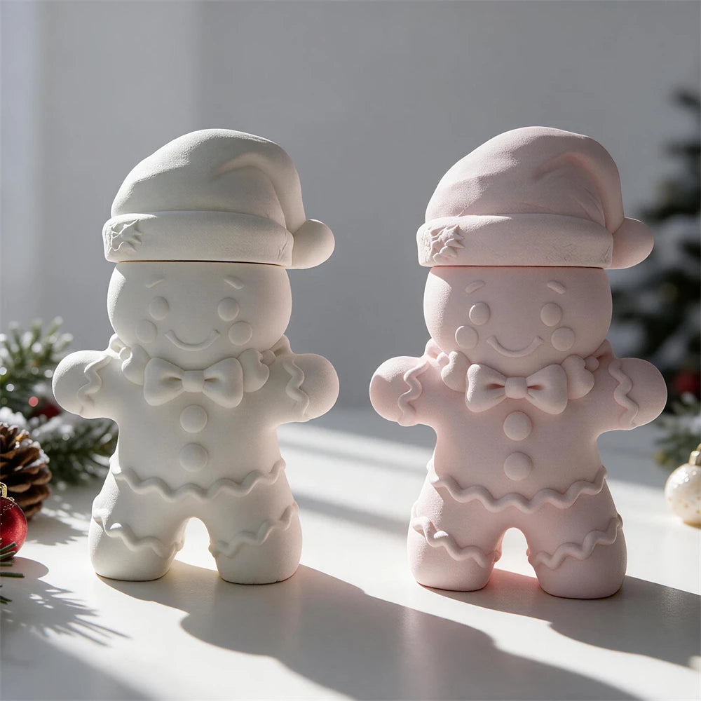 Gray and pink gingerbread-shaped lidded vessels with bow ties