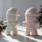 Gray and pink gingerbread-shaped lidded vessels with bow ties