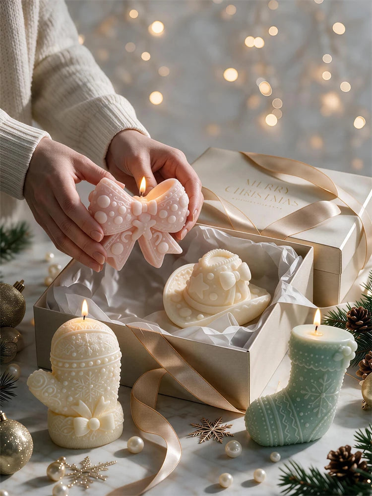 Hand holding a decorative winter bow candle among holiday accessories