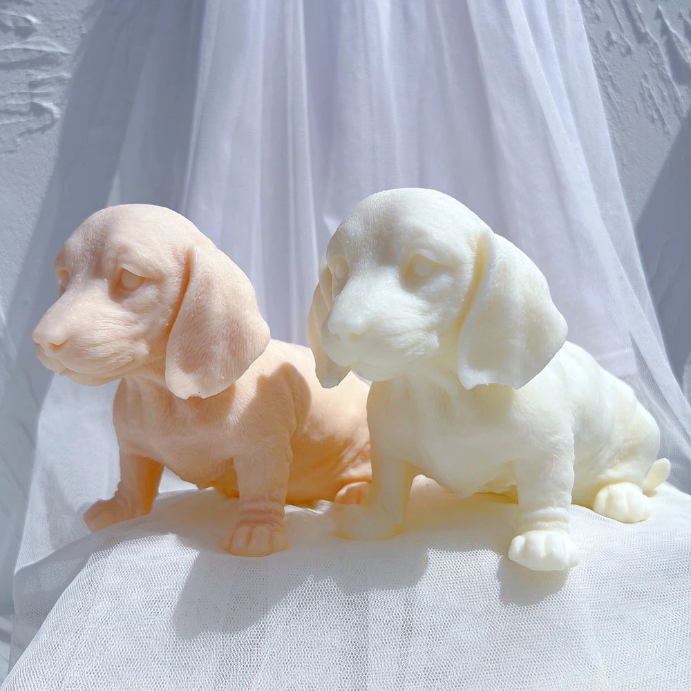 Peach and cream dachshund-style puppy castings in angled views