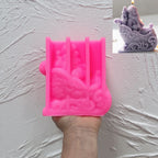 Pink silicone mold for Santa seated in scrollwork sleigh