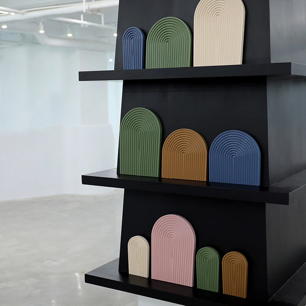 Small and large arch castings displayed on shelves