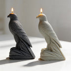 Side profiles of black and gray falcon castings with hooked beaks