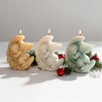Decorative angel crescent candles viewed from the side