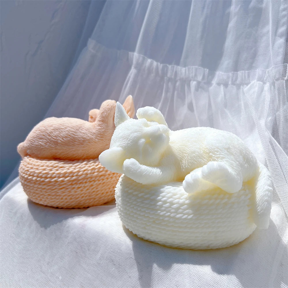 Rear and front views of cat-and-basket sculptures