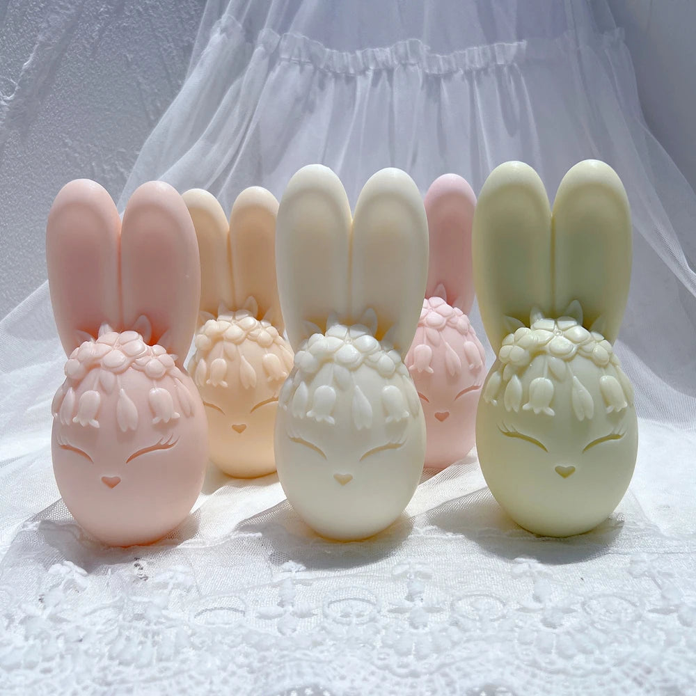 Pastel bunny egg castings with closed eyes and floral crowns