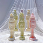 Pastel Christmas nutcrackers arranged in front and angled views
