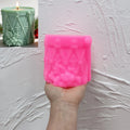 Pink silicone drum mold showing lacing and holly relief
