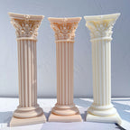 Three classical fluted column candle castings with leaf capitals
