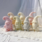 Two Christmas gnome casting designs with striped and star-decorated hats