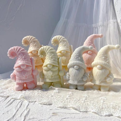 Two Christmas gnome casting designs with striped and star-decorated hats