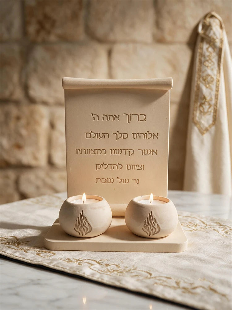 Close view of Hebrew-inscribed scroll plaque with rolled top and broad flat base