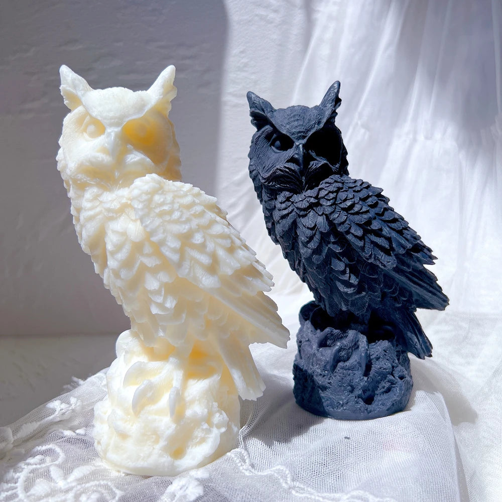 Cream and dark owl castings with pointed ear tufts on textured perches