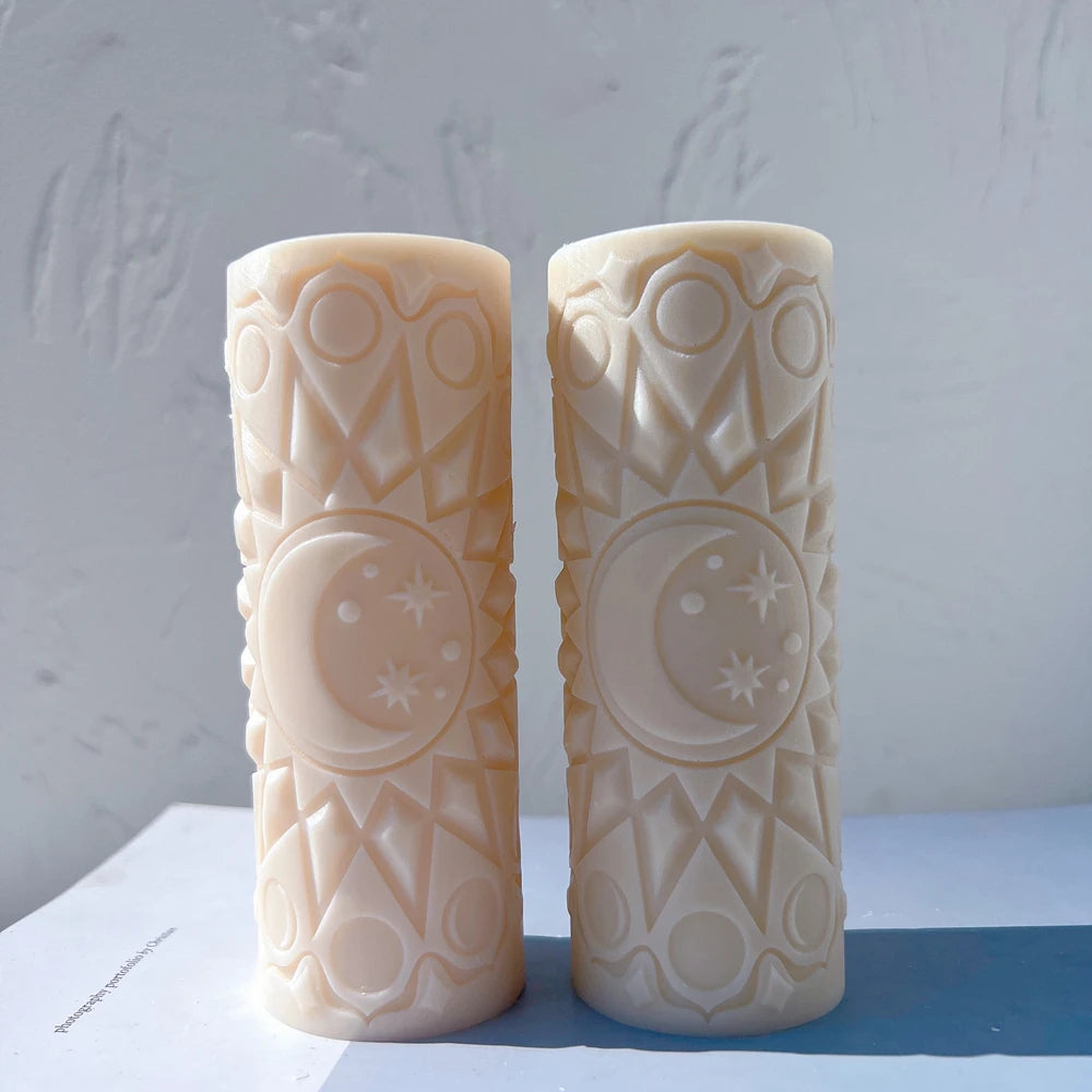 Peach and cream celestial pillar candles side by side