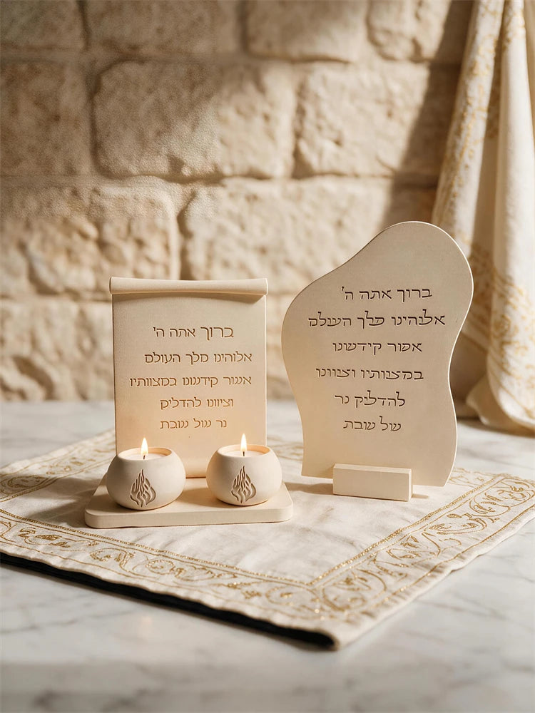 Scroll plaque design with rolled top beside separately cast tealight decorations
