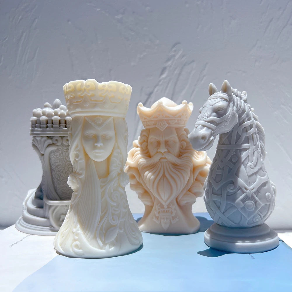Four sculptural chess pieces with faces, horse mane and turret detail