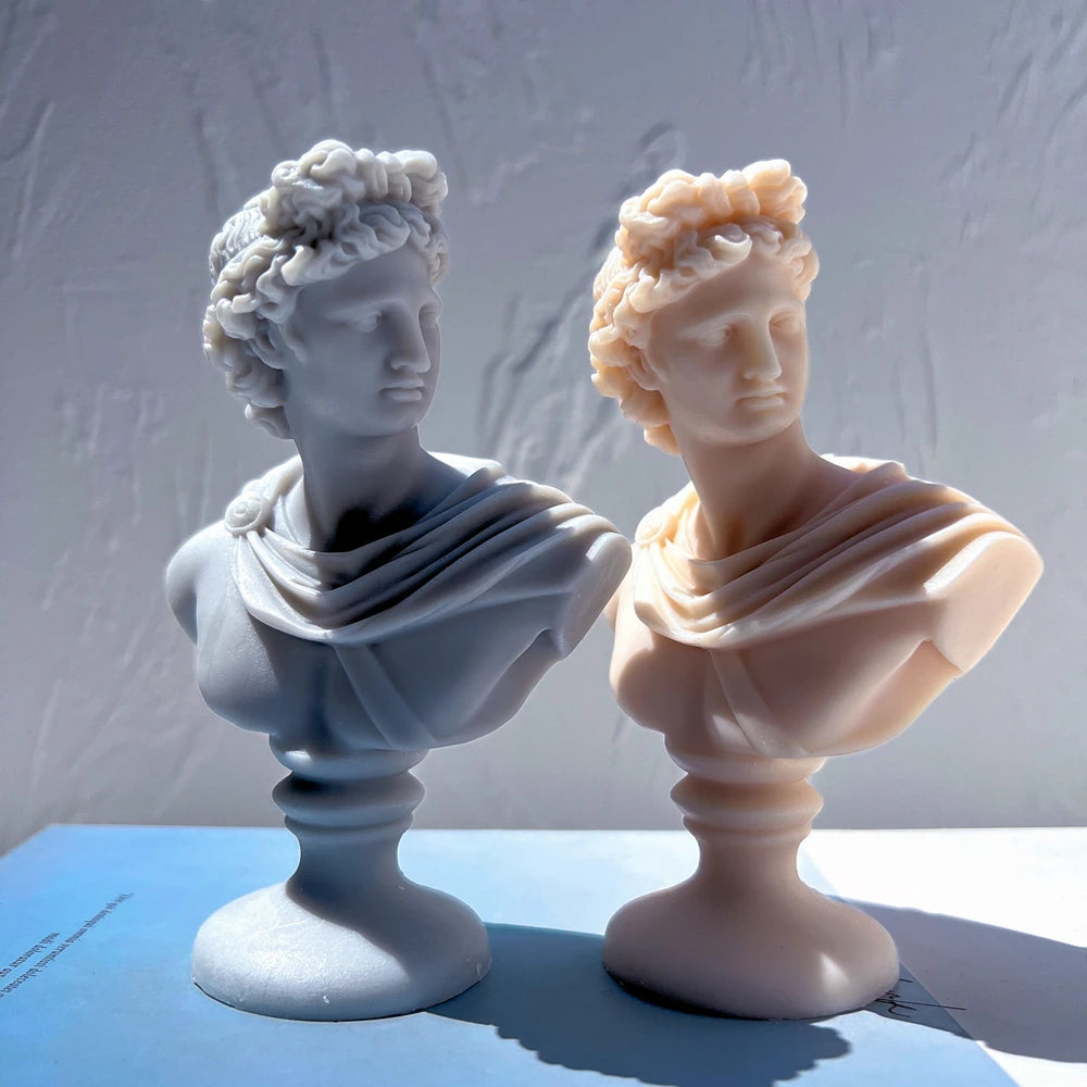 Gray curly-hair and peach swept-hair classical bust candles
