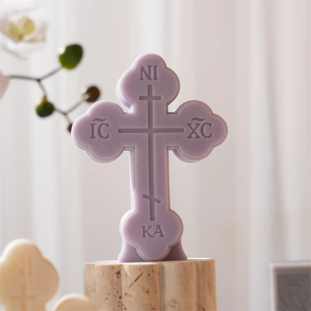 Purple rounded-end cross casting with embossed lettering