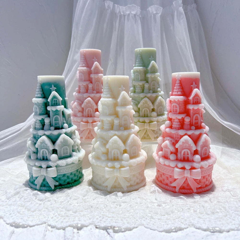 Five pastel castle tower castings with bow-decorated bases