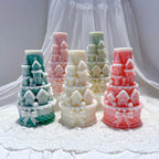 Five pastel castle tower castings with bow-decorated bases