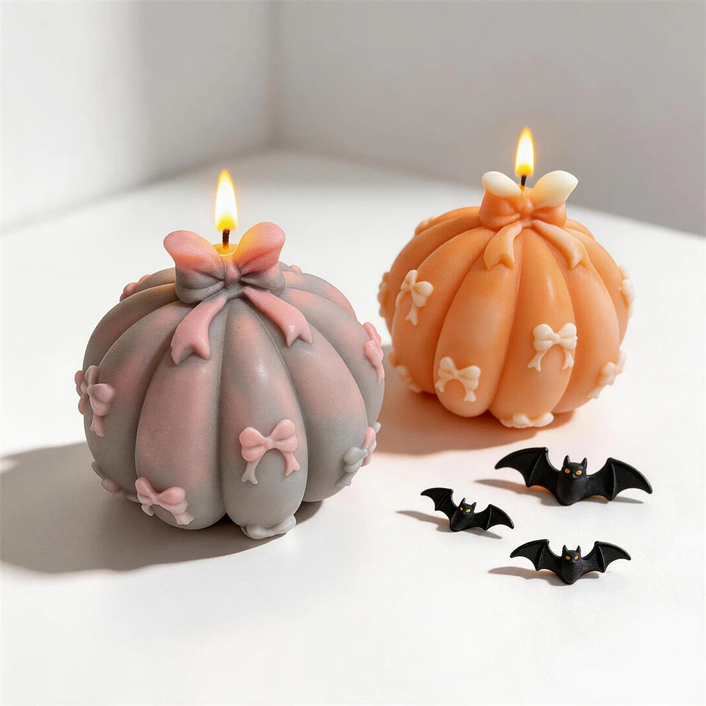 Gray and orange bow pumpkins with larger bows at the crown