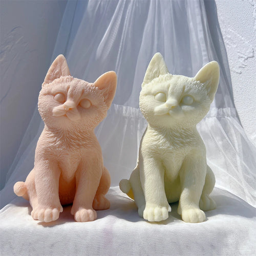 Peach and cream seated cat castings with upright ears and front paws