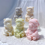 Close group of bears holding connected gift boxes
