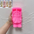 Pink silicone winter figure mold with hat scarf and boot cavities