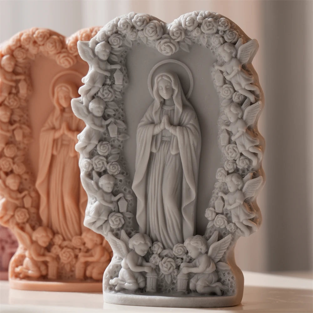 Gray and peach praying figure reliefs with ornate borders