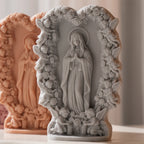 Gray and peach praying figure reliefs with ornate borders