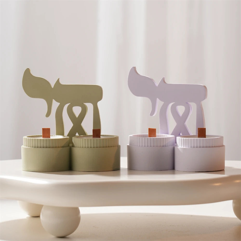 Cream and lavender curved horn motif castings with cup-like bases