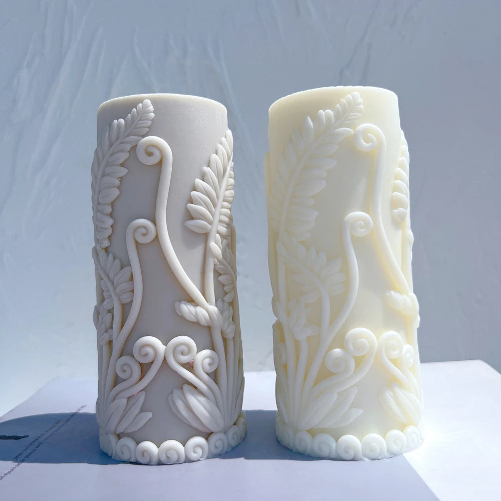 Fern and scroll pillar candle castings in gray and ivory