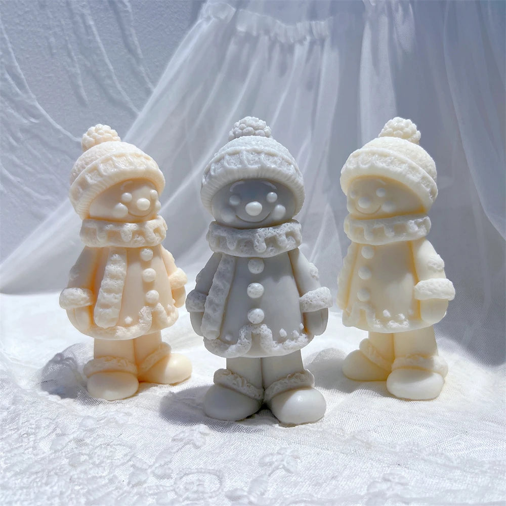 Gray and pastel winter figure castings with rounded faces