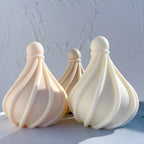 Three spiral droplet candle castings with smooth ball tops