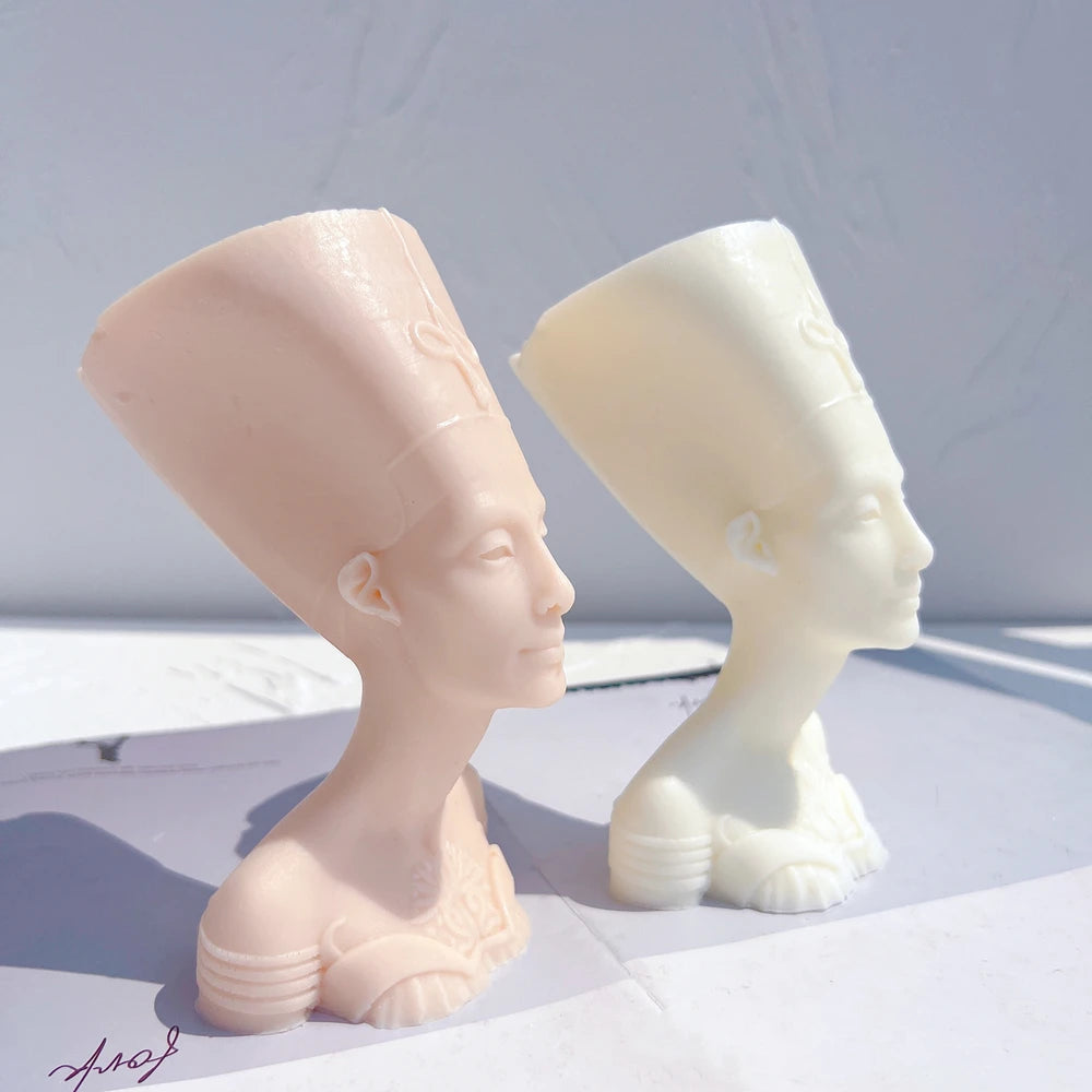 Side profiles showing the tall flared headdress and long neck