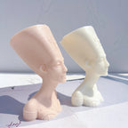 Side profiles showing the tall flared headdress and long neck