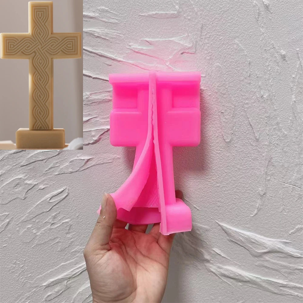 Pink Straight + Base cross silicone mold beside a gold casting